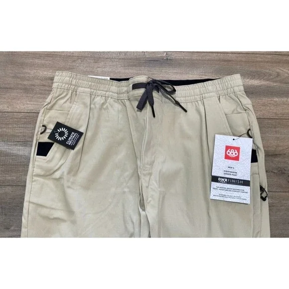686 Everywhere Pant Mens L Stretch Beige Slim Jogger Zipper Pockets Drawstring - Picture 2 of 9